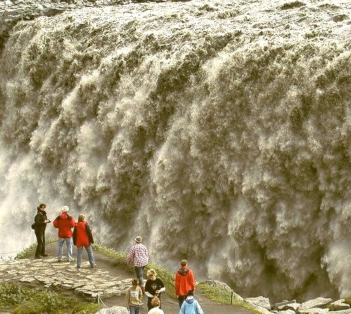 by ystenes on Flickr.Admiring the power of mighty Detifoss Waterfall in Iceland.