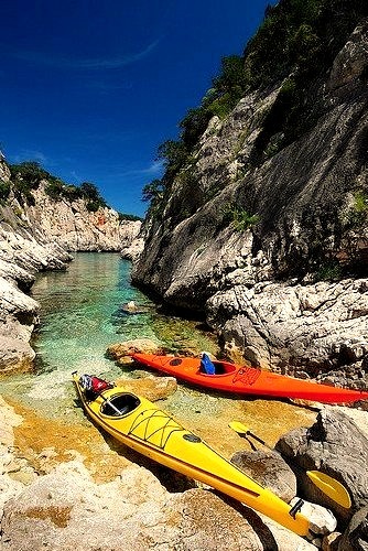 Two canoes at the end of Porto Pedrosu, Sardinia, Italy